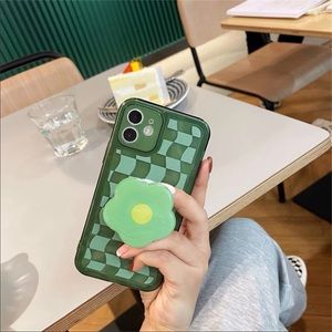Green checkered phone case with flower bracket